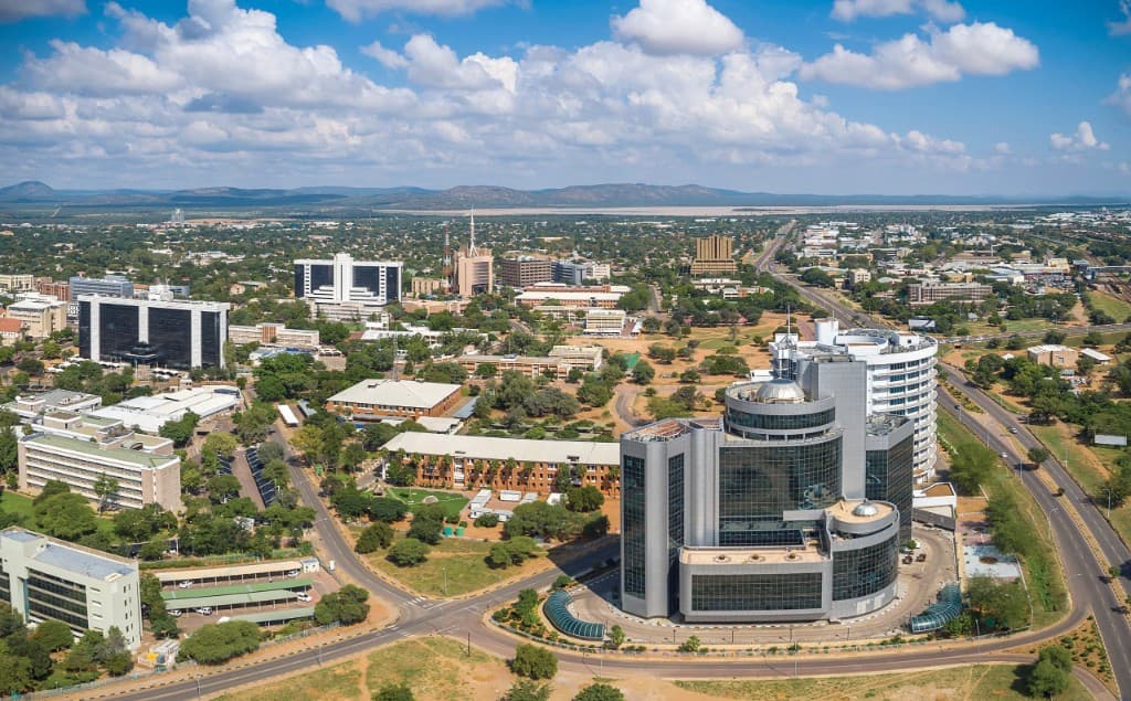 Aerial view of a modern cityscape in Botswana under a clear sky